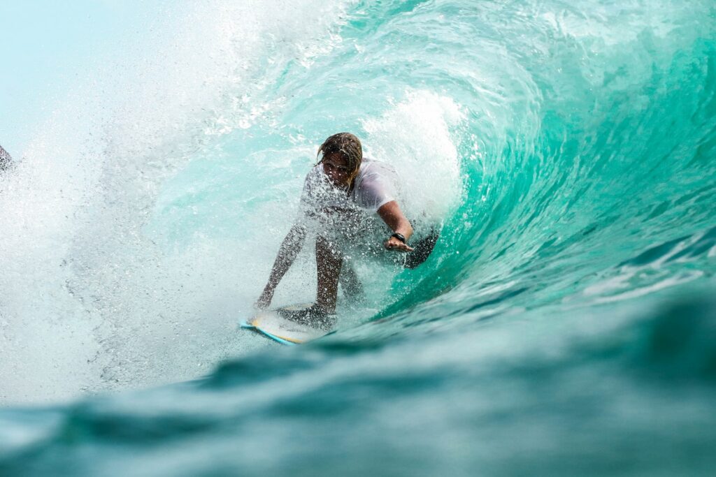 time lapse photography surfer in wave water
